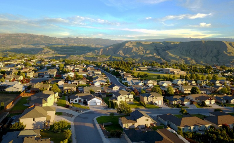 Small Town Aerial Pictures in green mountainous background