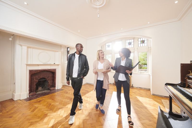 Realtor showing clients a home