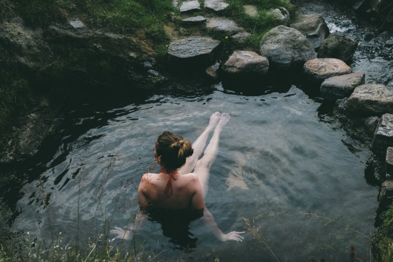Woman bathing in a hot spring in Chelan County, WA