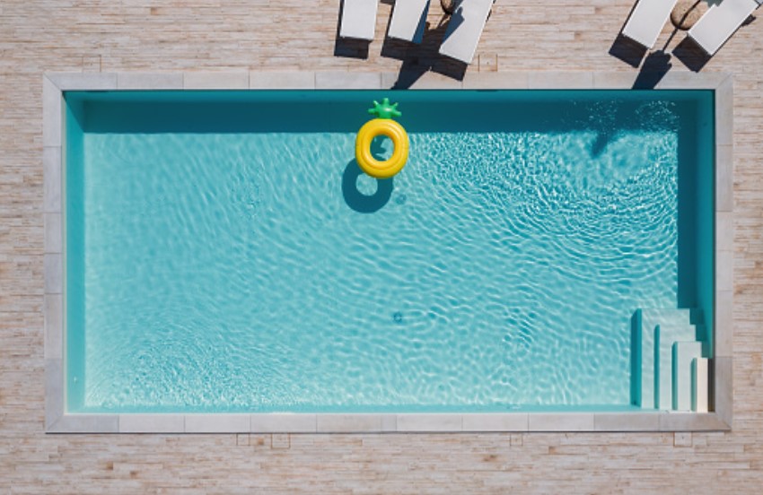 Empty rectangular blue swimming pool