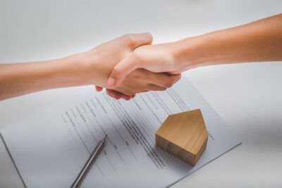 Landlord and tenant handshake